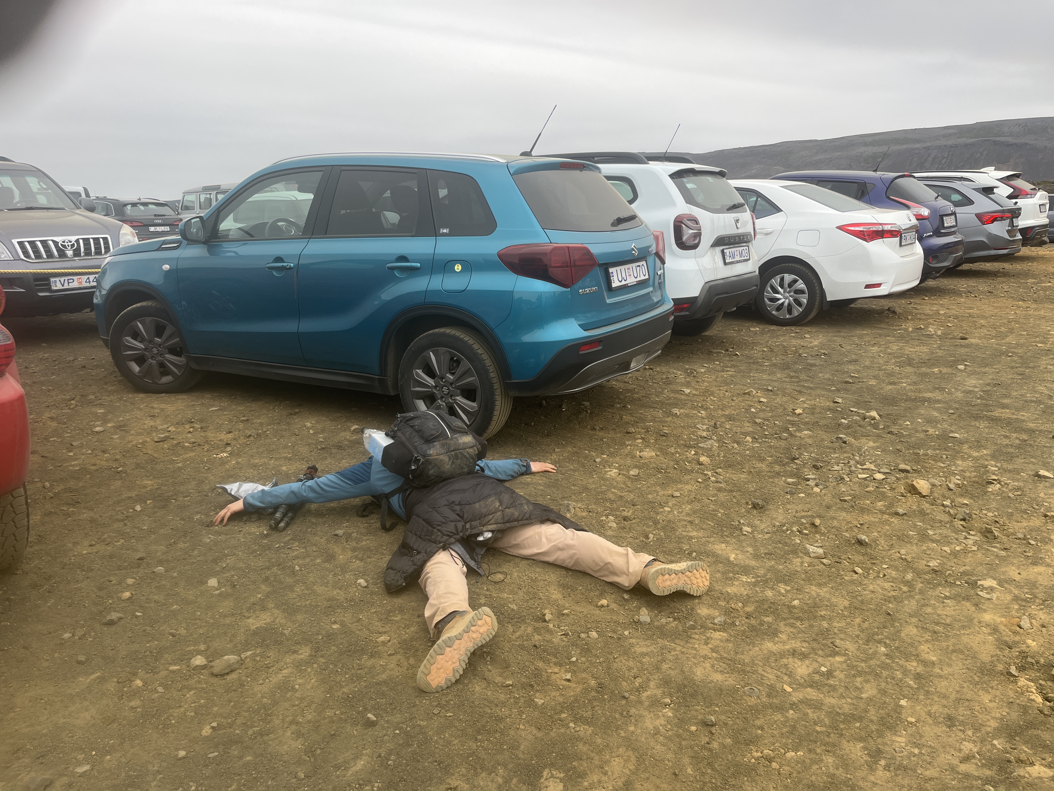 The author facedown in the dirt at the parking lot.