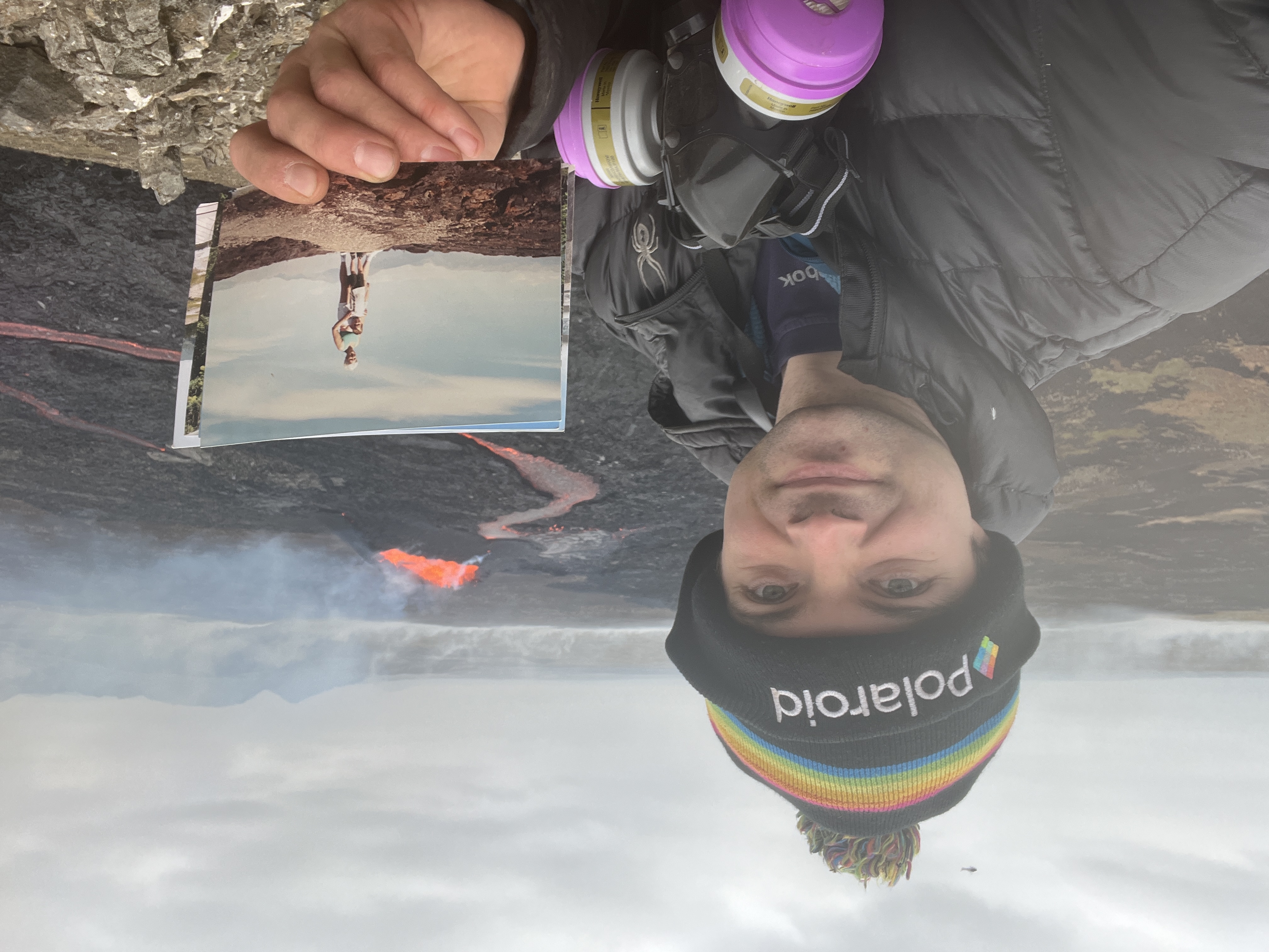 The author with a photo of himself and his grandmother at a volcano in 2001.