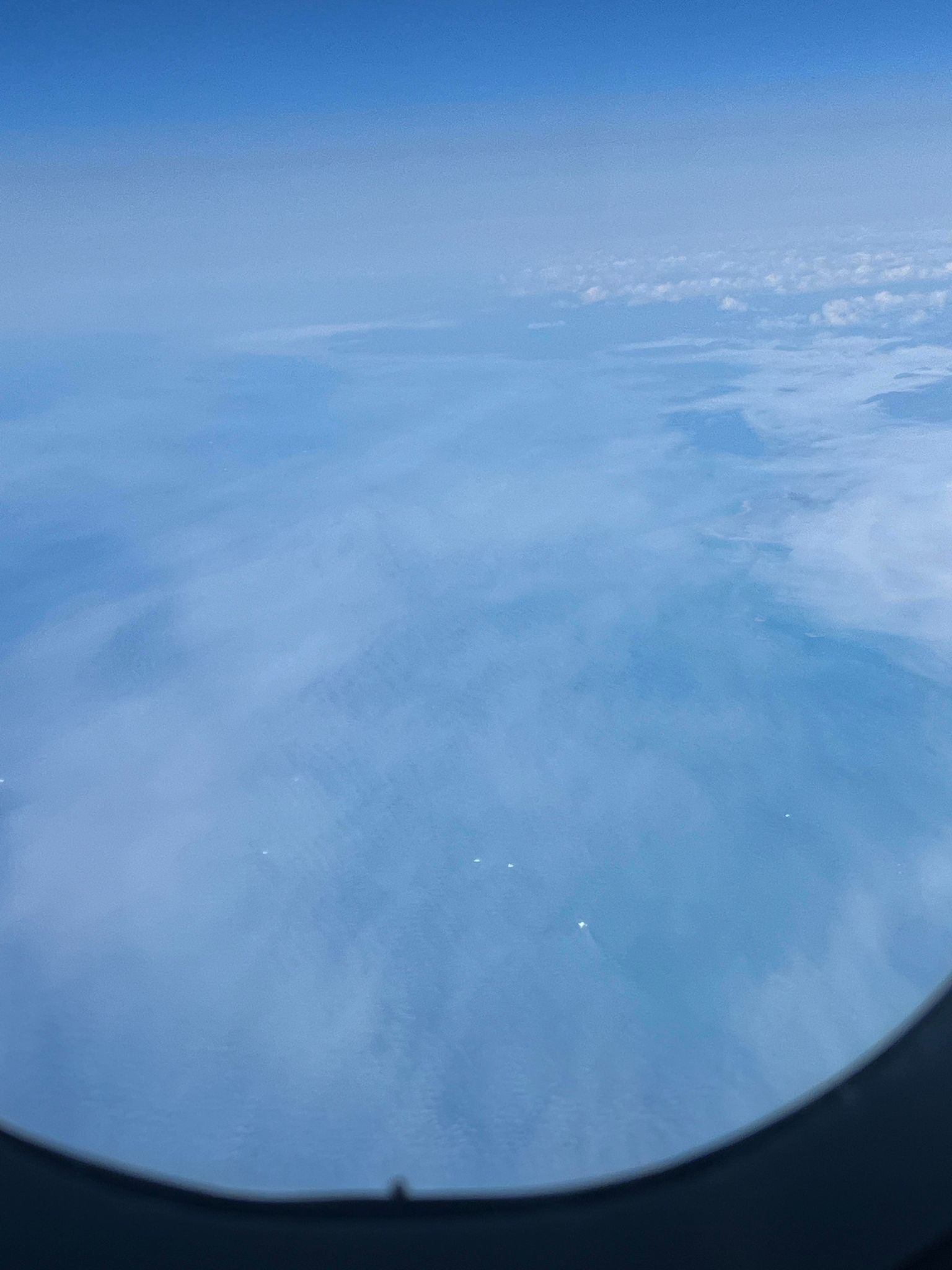 Icebergs off the west coast of Greenland from the plane home.